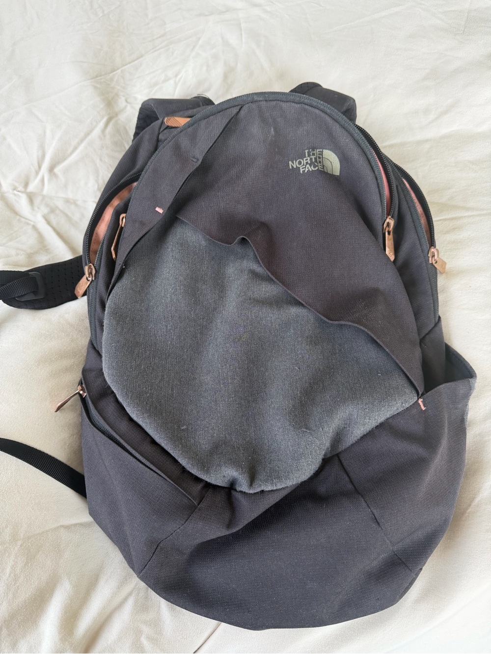 The North Face Black Backpack with Rose Gold Zippers